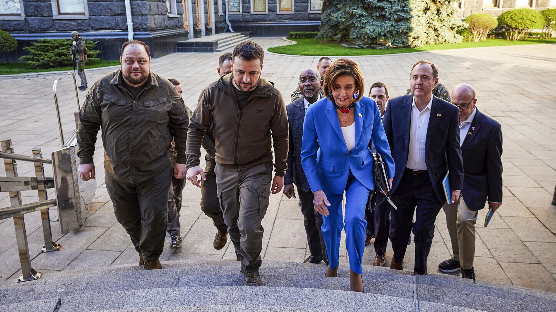 Pelosi and Democratic leadership walking up steps in Ukraine with Volodymyr Zelenskyy 
